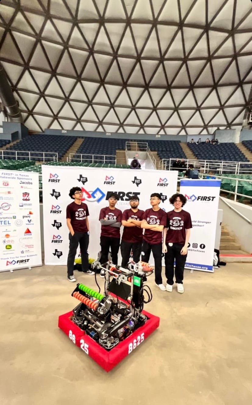 FRC Team 8625 with their robot on the competition floor at a FIRST in Texas event